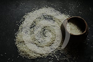 Rice spilled from a traditional measuring pot named kunke photo