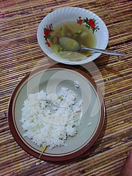 Rice is the staple food of Indonesians with papaya mixed with eggplant and long beans