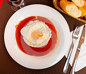 Rice with tomato and fried egg. Cuba style rice closeup