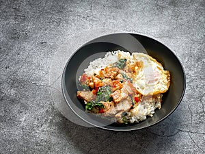 Rice topped with crispy pork belly with Thai basil