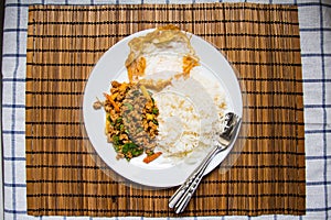 Rice topped with stir-fried pork and basil