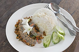 Rice topped with Stir Fried Pork with yellow curry paste