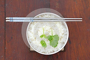 Rice in white bowl with chopstick