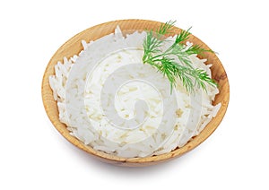 Rice in a wooden bowl isolated on white background. Top view. Flat lay