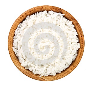 Rice in a wooden bowl isolated on white background. Top view. Flat lay