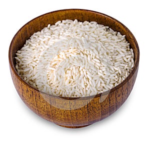 Rice in wooden bowl on white background.