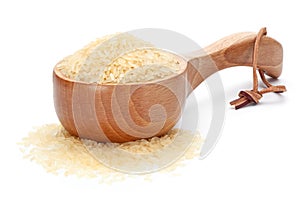 Rice in woodenware on the white