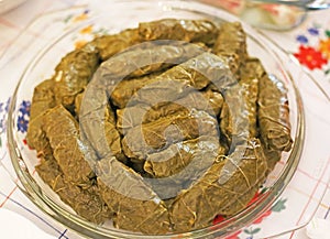 Rice wrapped in grape leaves - traditional greek food called dolmadakia photo