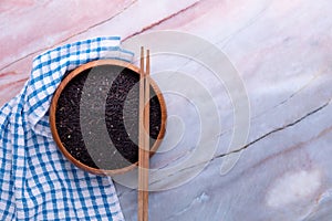 Riceberry rice in wooden blow and background