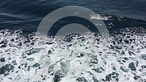 Rich Blue Caribbean Water Going By a Cruising Ship.