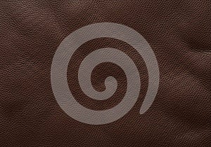 Rich brown leather texture with a slightly uneven surface. The