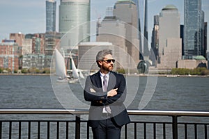 Rich business man executive standing in New York City. Business American success. American business dream. American