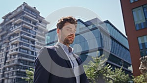 Rich businessman going downtown sunny morning close up. Successful man walking