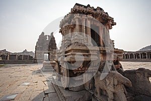 A rich carved stone chariot inside the Vittala Hindu temple in the ancient site Hampi, Karnataka, India