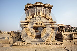 A rich carved stone chariot inside the Vittala temple in Hampi, Karnataka, India
