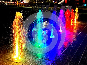 Rich Colorful Water Fountain Jets at Night