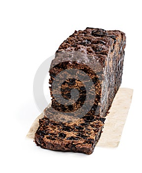 Rich dark fruit cake isolated on white