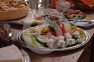 Rich Decorated Buffet Food Table with different Plates