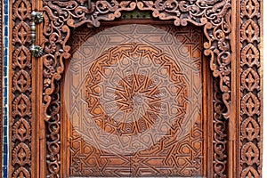 Rich decorated door in an Arab palace in Marrakech