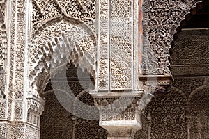 Rich decorated facade in the courtyard of a Medersa in Morocco