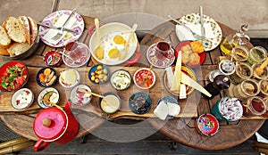 Rich and delicious Turkish breakfast on a round table photo