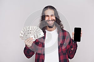 Rich handsome young brunette businessman in red checkered shirt