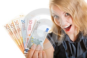 Rich happy business woman showing euro currency money banknotes
