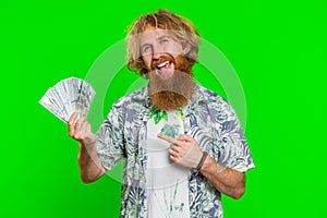 Rich happy man winner waving money dollar cash like a fan, big income wealth success business