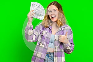 Rich happy woman winner waving money dollar cash like a fan, big income wealth success business