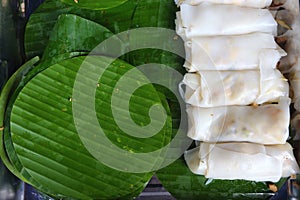 Rich noodle paste with bean on Green Banana leaf with oil and galic, copy space for text and logo, urban food in asian,