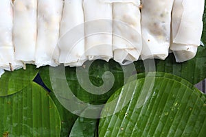 Rich noodle paste with bean sprout on Banana leaf with oil and galic, copy space for text and logo, urban food in asian,