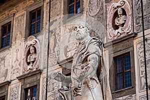 Rich ornate facade of the Palazzo della Carovana in the center of Pisa