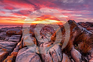 Rich red sunrise over the rocky coast Australia