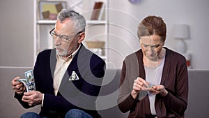 Rich senior man holding dollars, poor woman counting coins, social gap, money