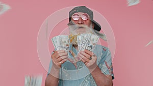 Rich senior man waving money dollar cash success business career, lottery winner, big income, wealth