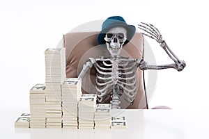 The Rich skeleton put up a hand and stack of bills placed on a w