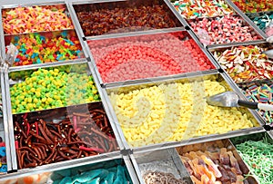 rich stall with lots of sugary candies and various sweets for sale in the town