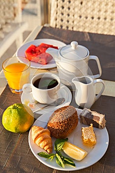 Breakfast on table at open terrace in Turkish resort