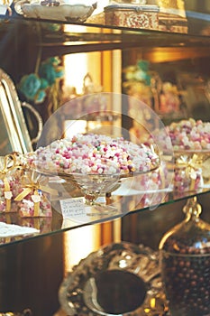 Rich variety of chocolates and candies in display window of ita