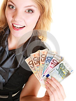 Rich woman showing euro currency money banknotes.