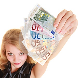 Rich woman showing euro currency money banknotes.