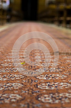 Richly colored in red, orange, blue and white carpet texture