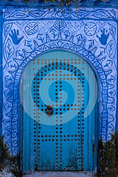 Richly decorated blue door