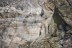 Richly structured rock surface of a vertical rock face with a small overhang - detail view of the Goldstein, which is part of the