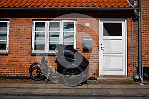 Rickshaw bike parked in front of the house