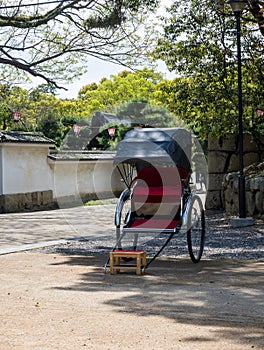 Rickshaw cart at the entrance to historic Marugame castle