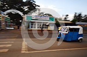 Rickshaw driving through the town of Ambo, Ethiopia