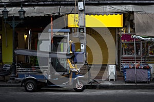 Rickshaw or tuk tuk taxi parked in the street