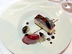Ricota mouse with red berry fruit jelly and glaze and sorbet photo
