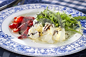 Ricotta cheese with grilled red pepper and arugula salad